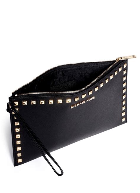 michael kors black clutch with gold handle|Michael Kors studded clutch.